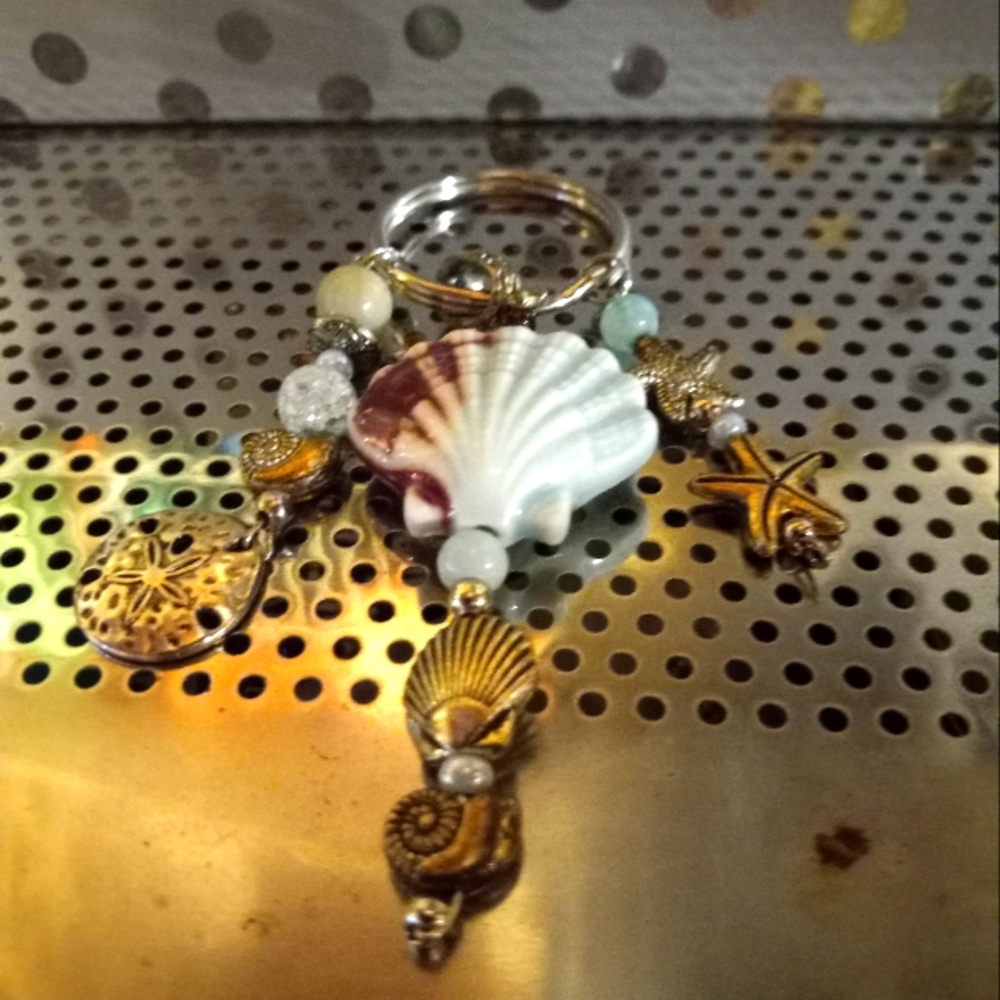 Ceramic  aqua shell  Keychain with  extra  charms  in assorted  shells and beads